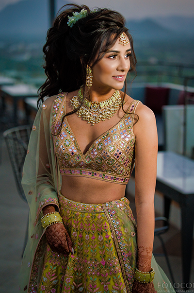 Anj & Pri In A Green Net Lehenga With A Sage Green Dupatta
