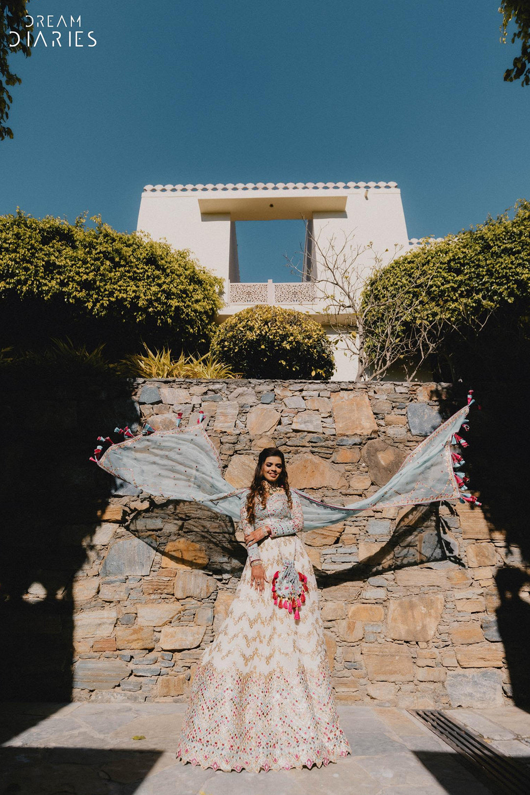 Jhanvi Kothari In Ivory Georgette Chevron Embroidered Lehenga Paired With A Blue Blouse And Organza Dupatta