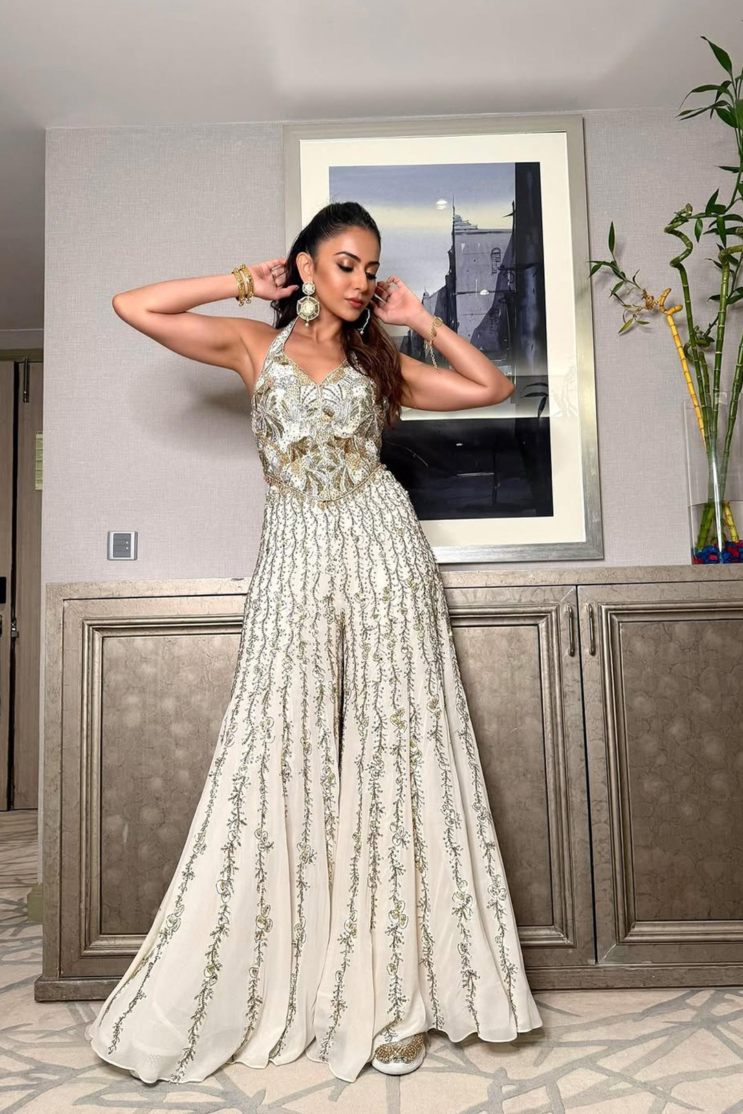 Rakulpreet in ivory georgette high waist sharara paired with a corset blouse