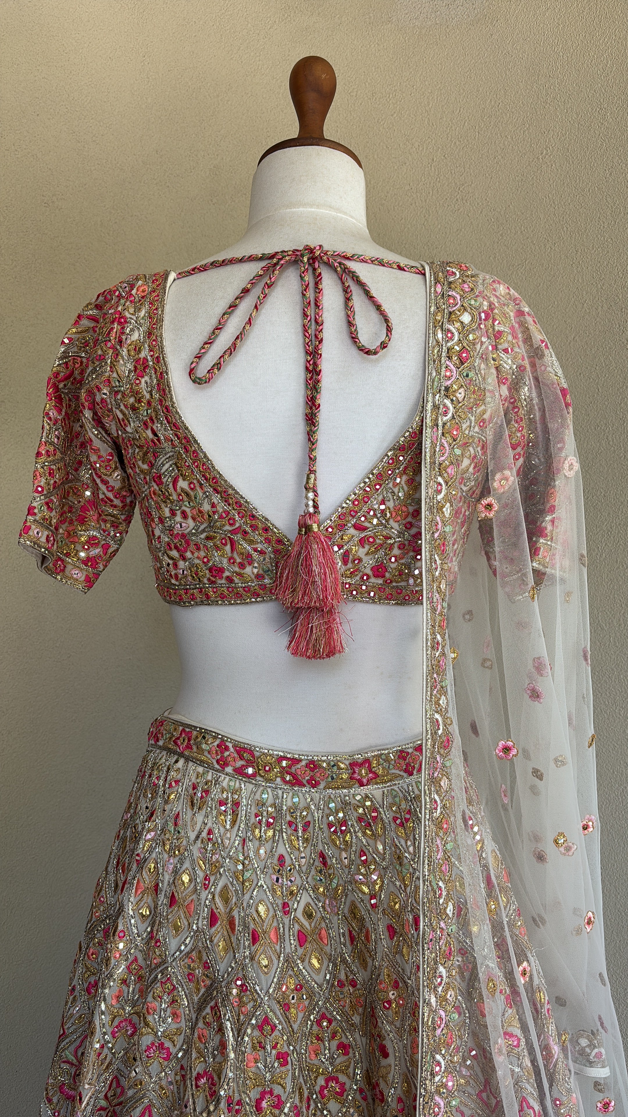 Ivory chanderi lehenga and blouse paired with a net dupatta