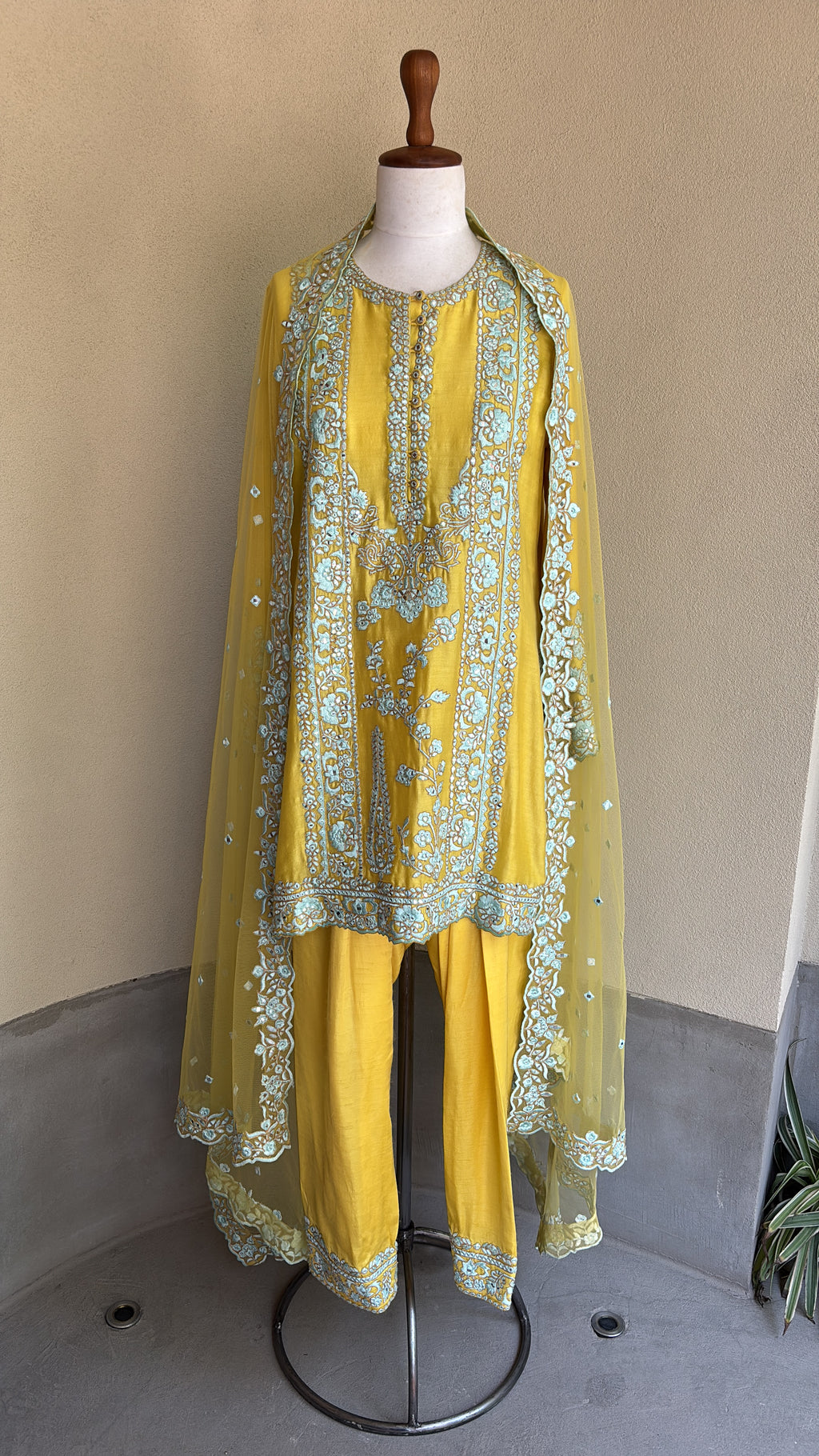 Yellow chanderi embroidered kurta and salwar paired with organza dupatta