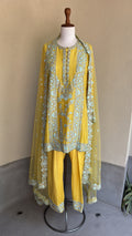 Yellow chanderi embroidered kurta and salwar paired with organza dupatta
