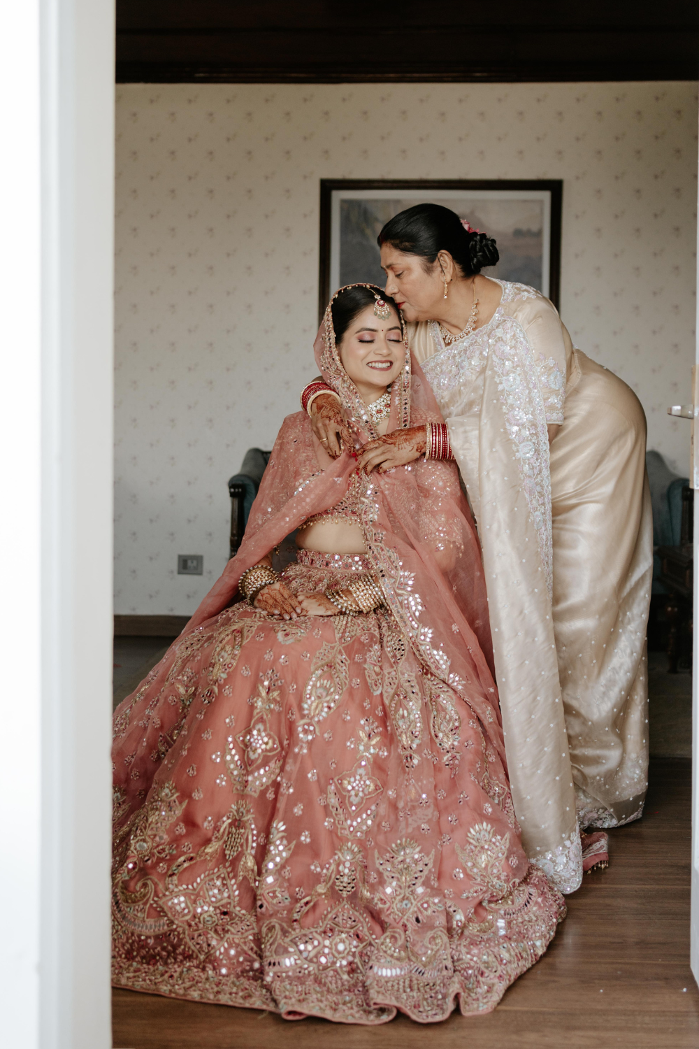 ANUSHA RAJ IN OUR SUFIYAANA SUNKISSED CORAL ORGANZA LEHENGA FOR HER WEDDING
