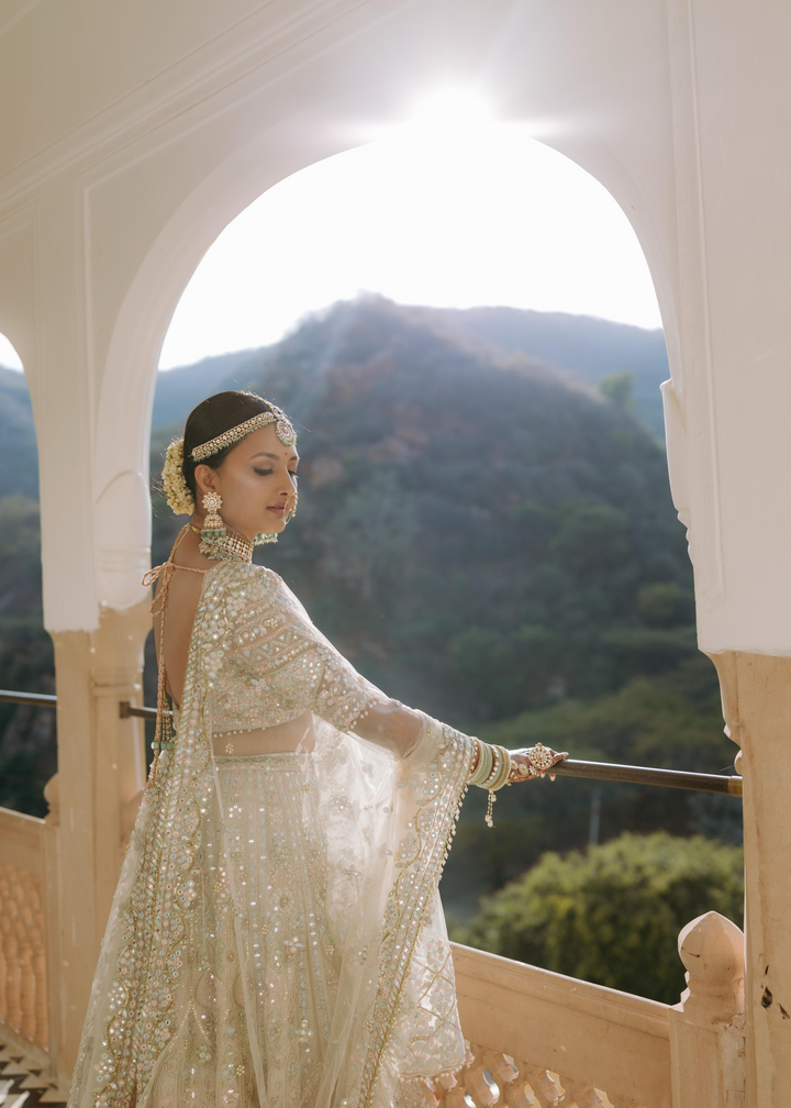 SHARANYA  IN OUR SERENADE IVORY MULTI COLOURED EMBROIDERED LEHENGA SET
