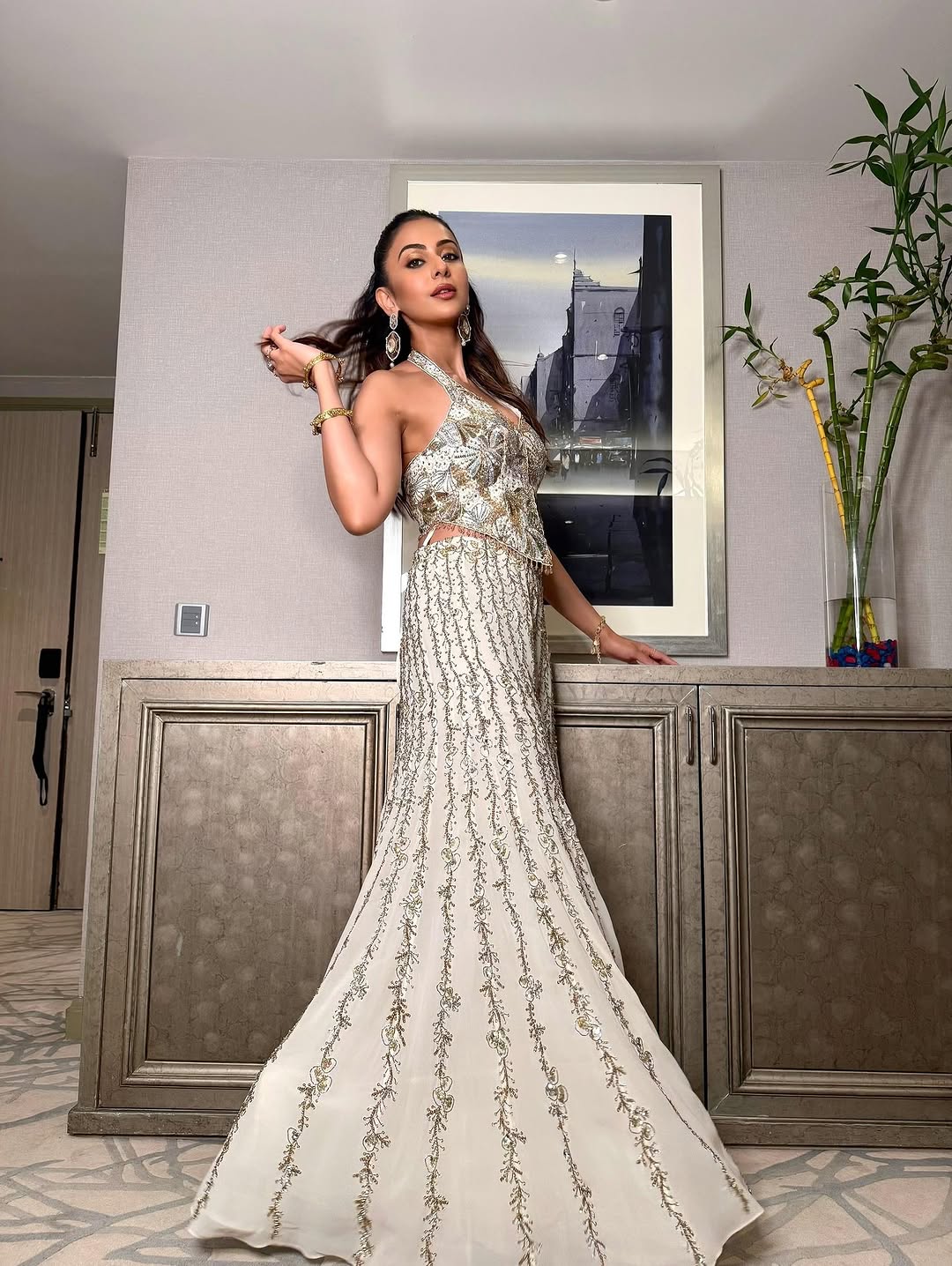 Rakulpreet in ivory georgette high waist sharara paired with a corset blouse