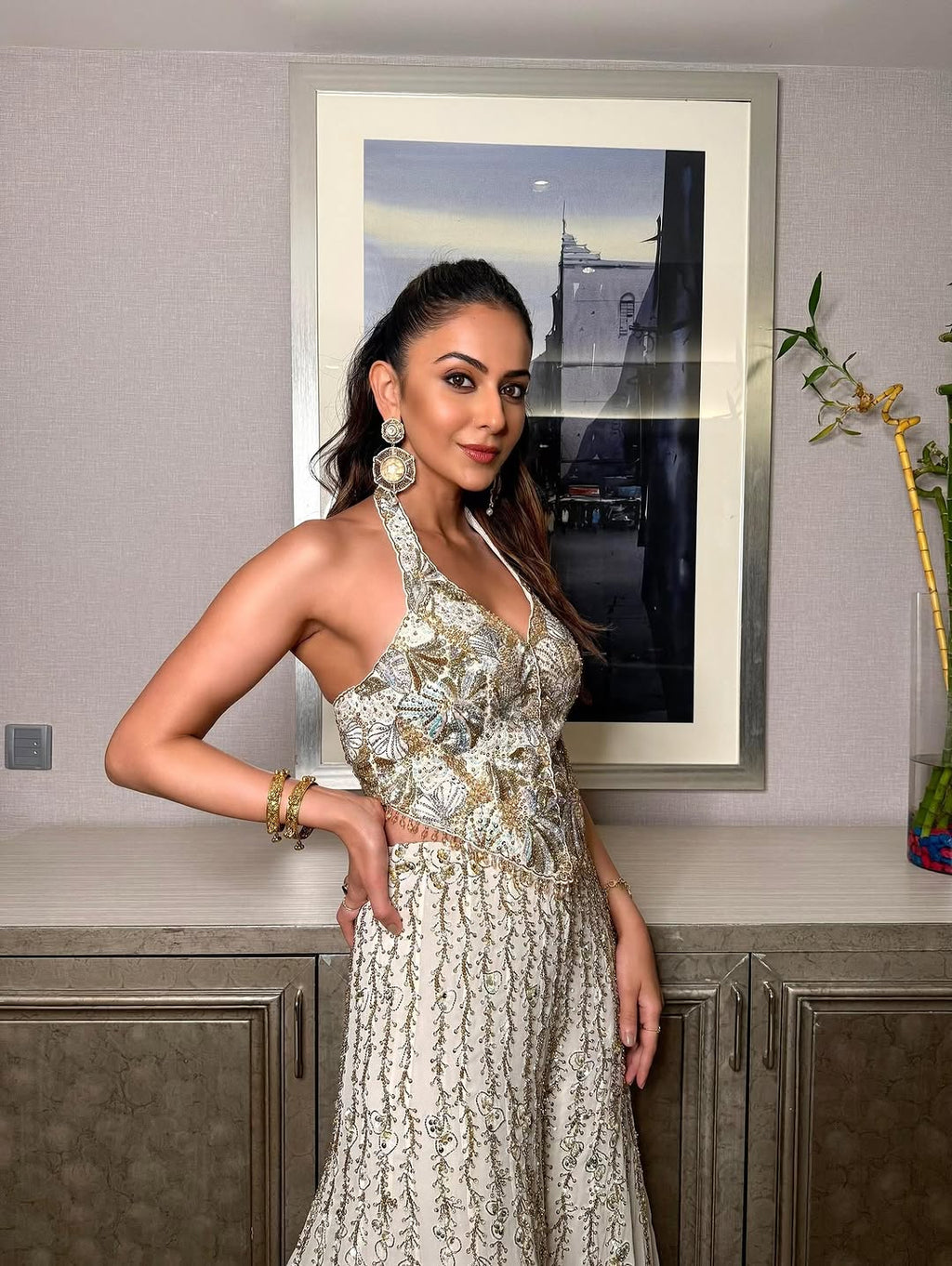 Rakulpreet in ivory georgette high waist sharara paired with a corset blouse