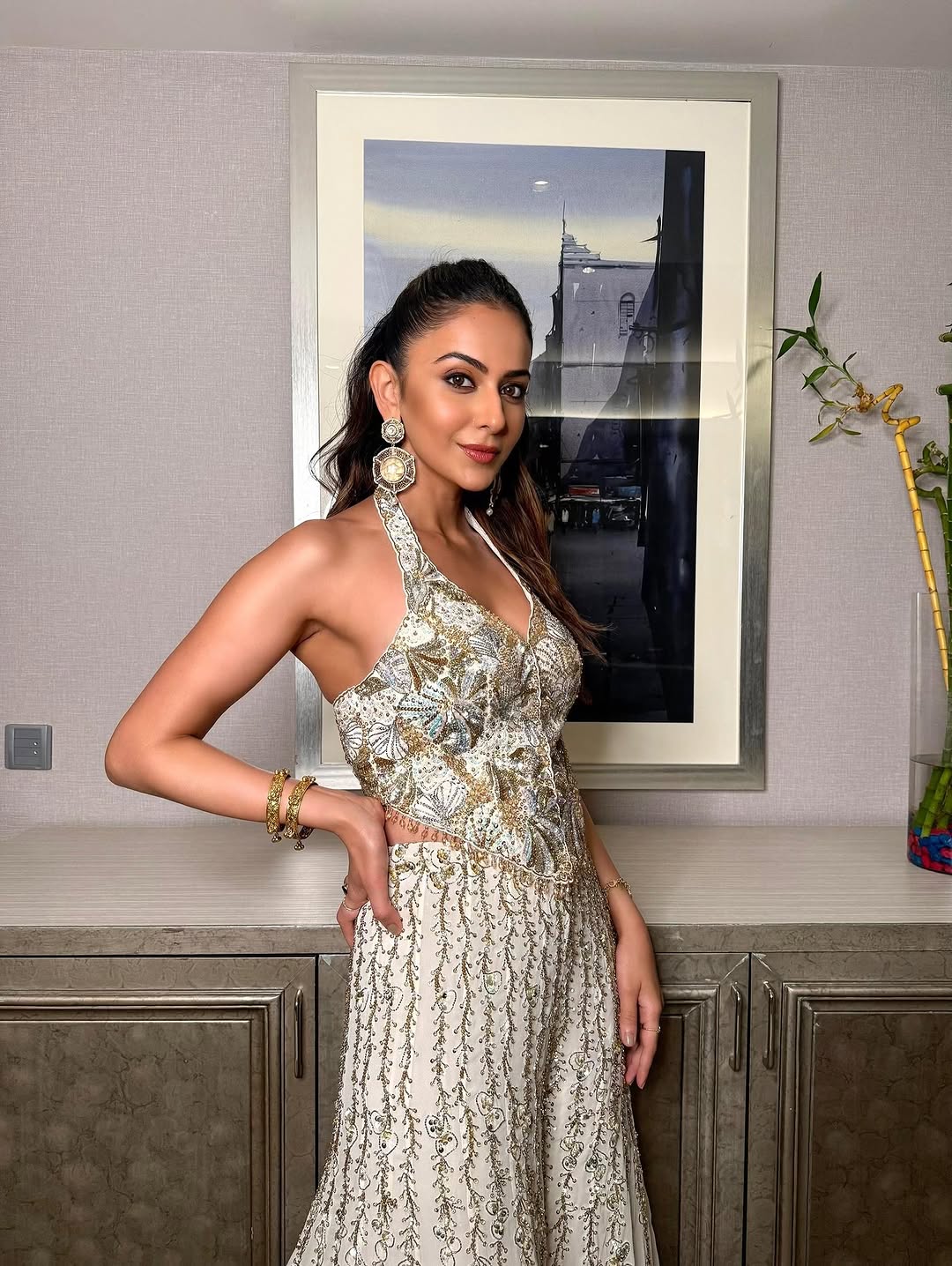 Rakulpreet in ivory georgette high waist sharara paired with a corset blouse