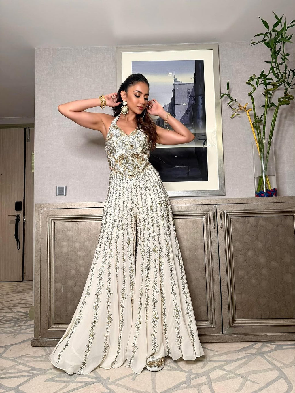 Rakulpreet in ivory georgette high waist sharara paired with a corset blouse