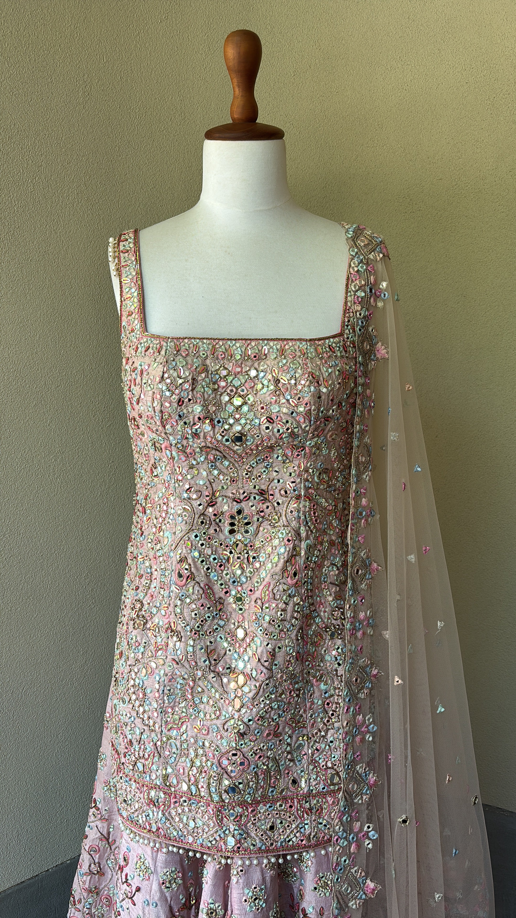 Pink rawsilk kurta and sharara paired with a net dupatta