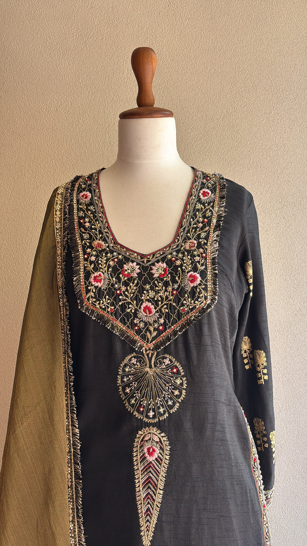 Black chanderi kurta and foil printed sharara paired with a tissue dupatta