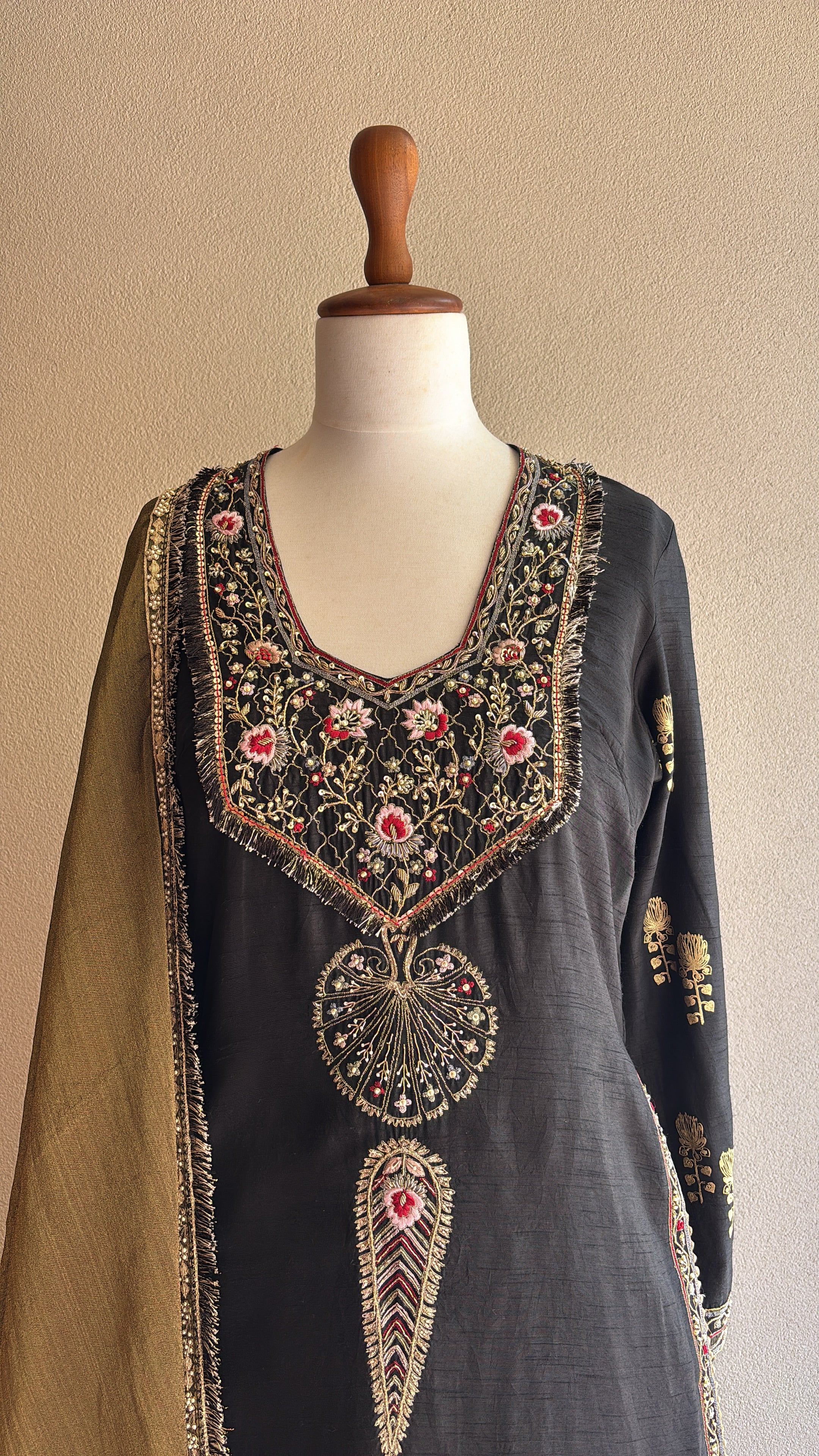 Black chanderi kurta and foil printed sharara paired with a tissue dupatta