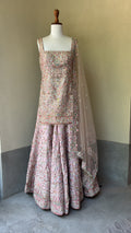 Pink rawsilk kurta and sharara paired with a net dupatta