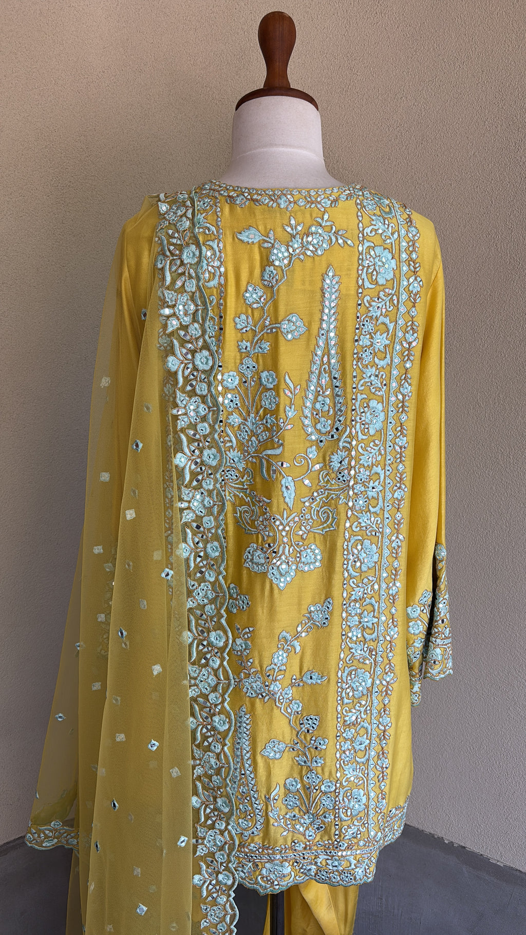 Yellow chanderi embroidered kurta and salwar paired with organza dupatta