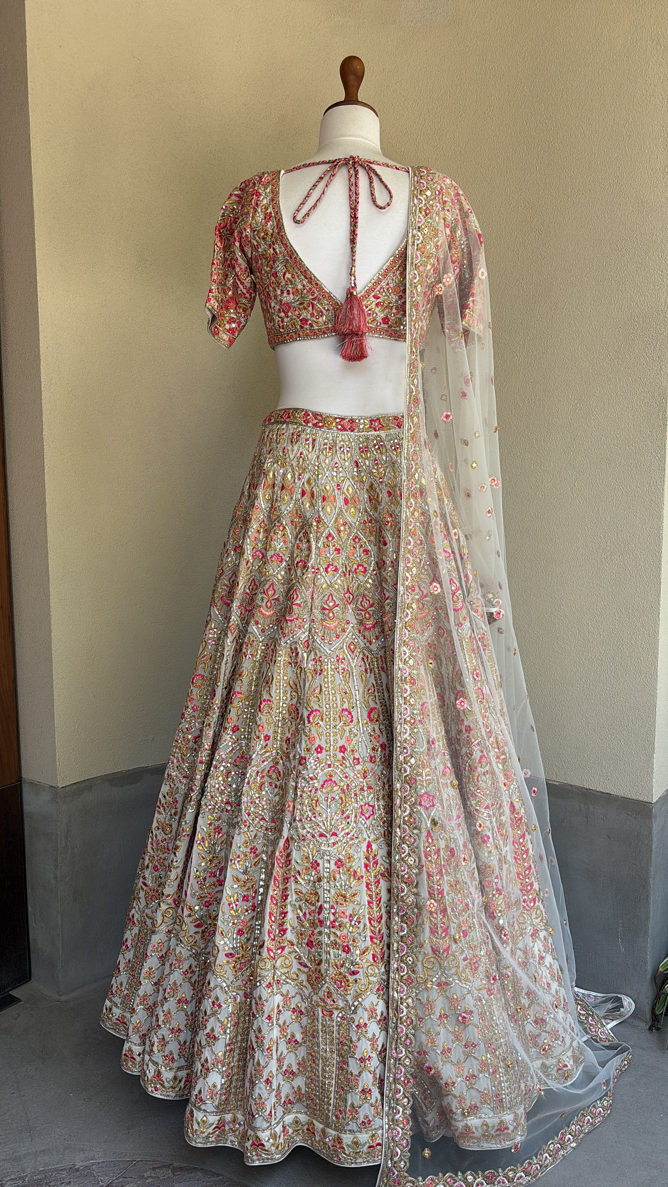 Ivory chanderi lehenga and blouse paired with a net dupatta