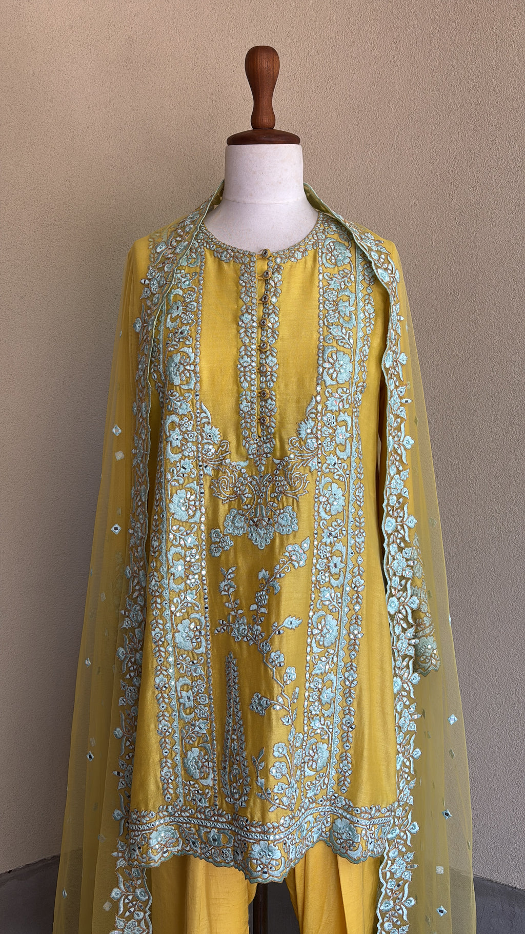 Yellow chanderi embroidered kurta and salwar paired with organza dupatta