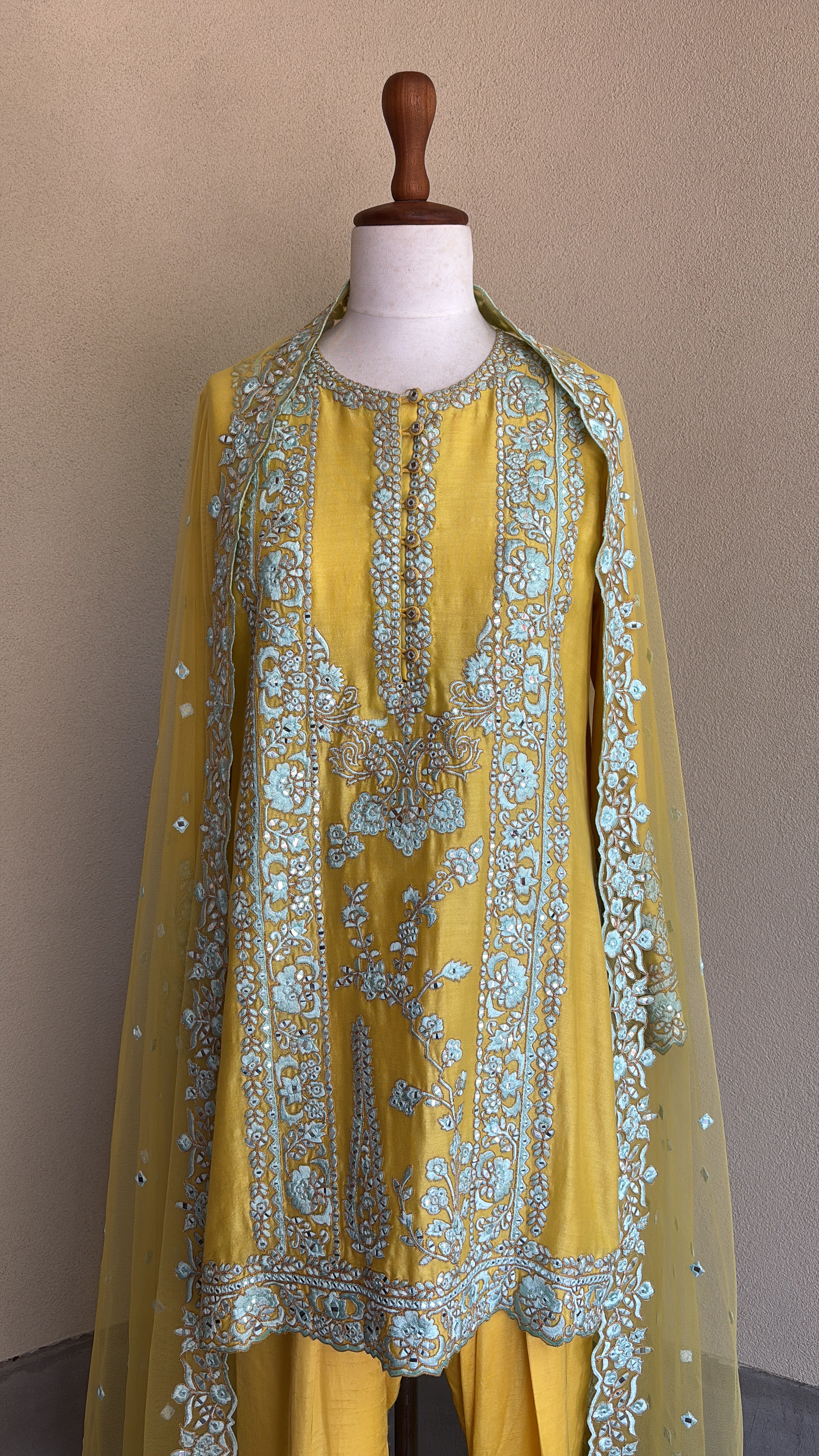 Yellow chanderi embroidered kurta and salwar paired with organza dupatta