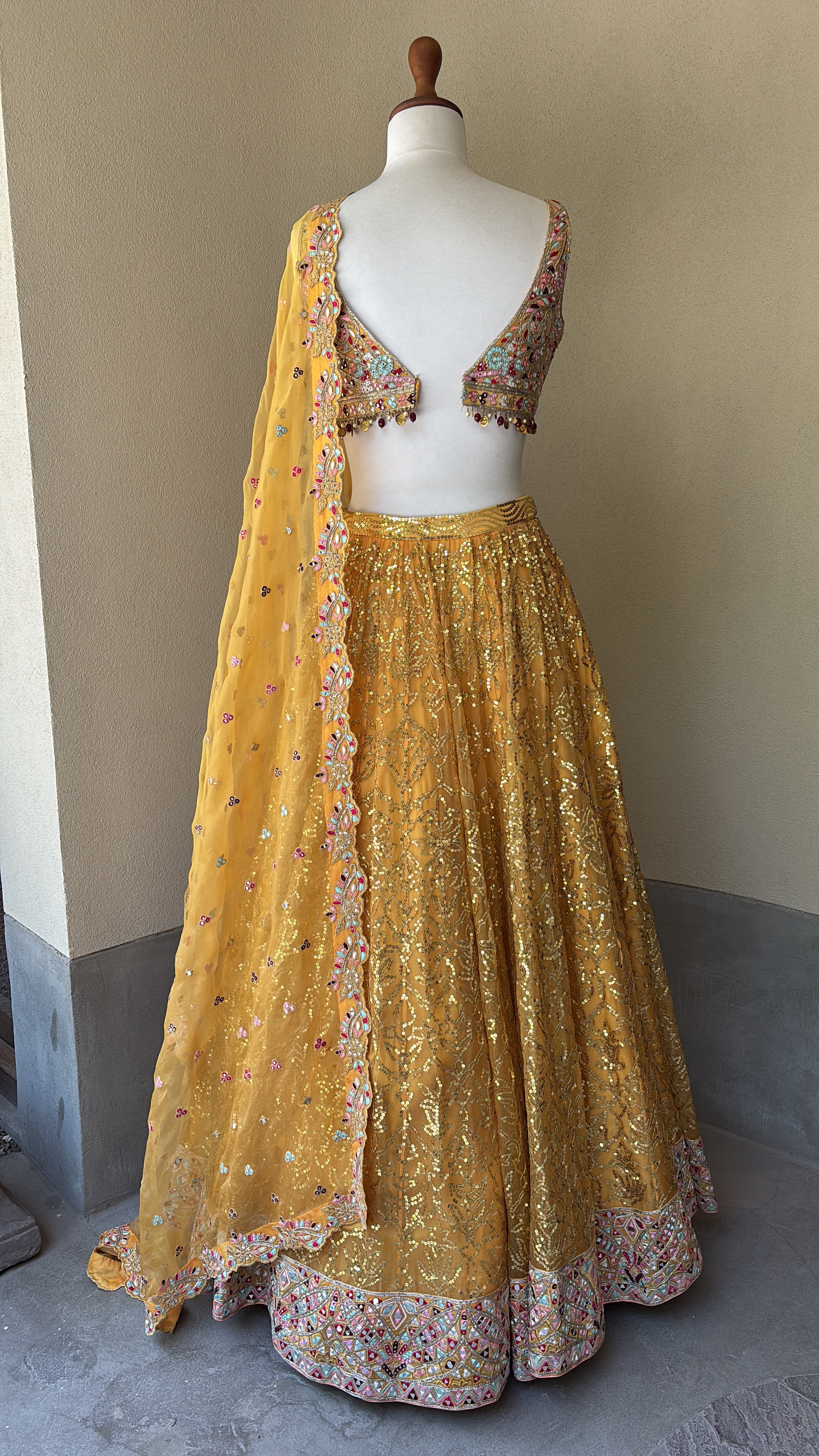 Orange Organza lehenga set with multi colored thread mirror and sequins