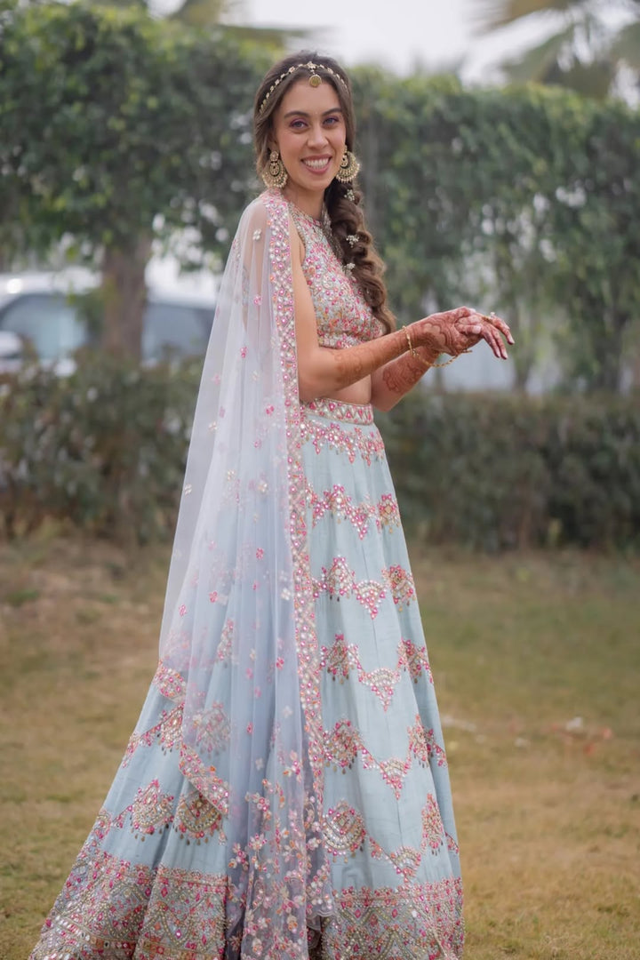 SARAH FELLAY IN OUR SERENADE ENGLISH BLUE MIRROR LEHENGA