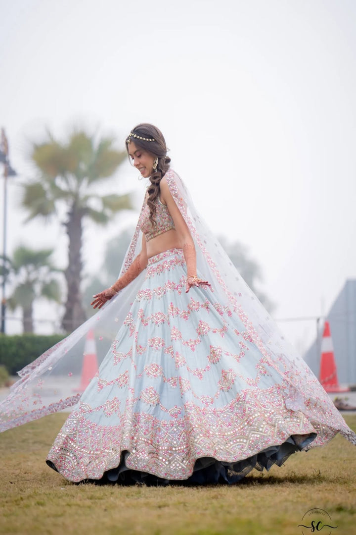SARAH FELLAY IN OUR SERENADE ENGLISH BLUE MIRROR LEHENGA