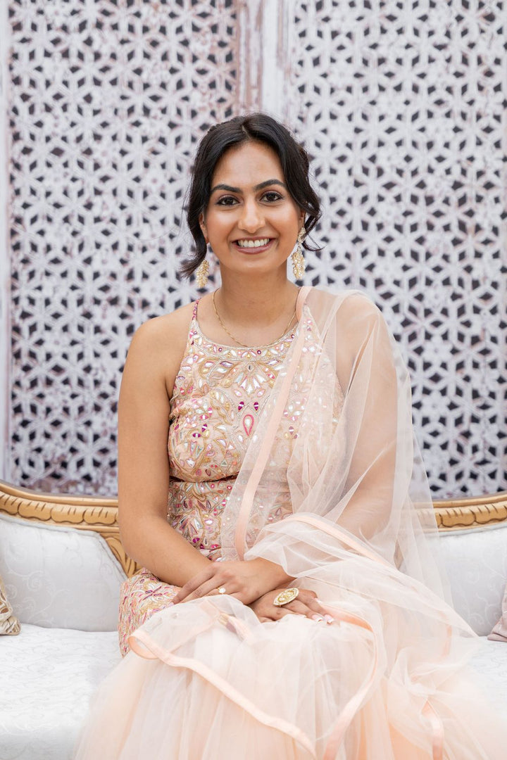 Manisha Punj In Peach Net Gharara With Foil Halter Kurta Set