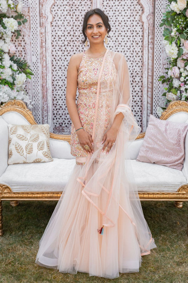 Manisha Punj In Peach Net Gharara With Foil Halter Kurta Set