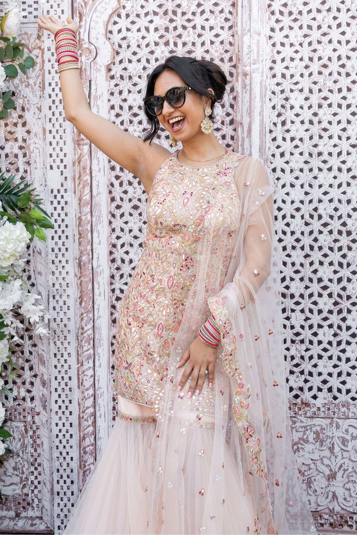 Manisha Punj In Peach Net Gharara With Foil Halter Kurta Set
