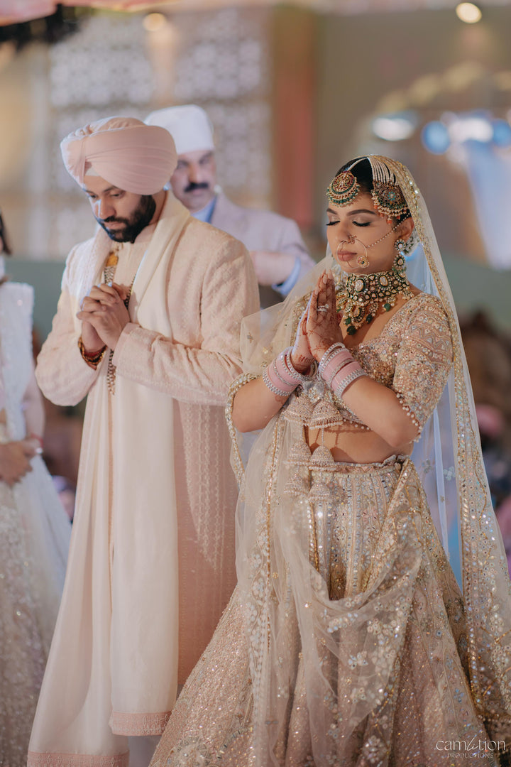 PAVIT SINGH IN OUR SERENADE IVORY WITH MULTI COLOURED EMBROIDERY LEHENGA
