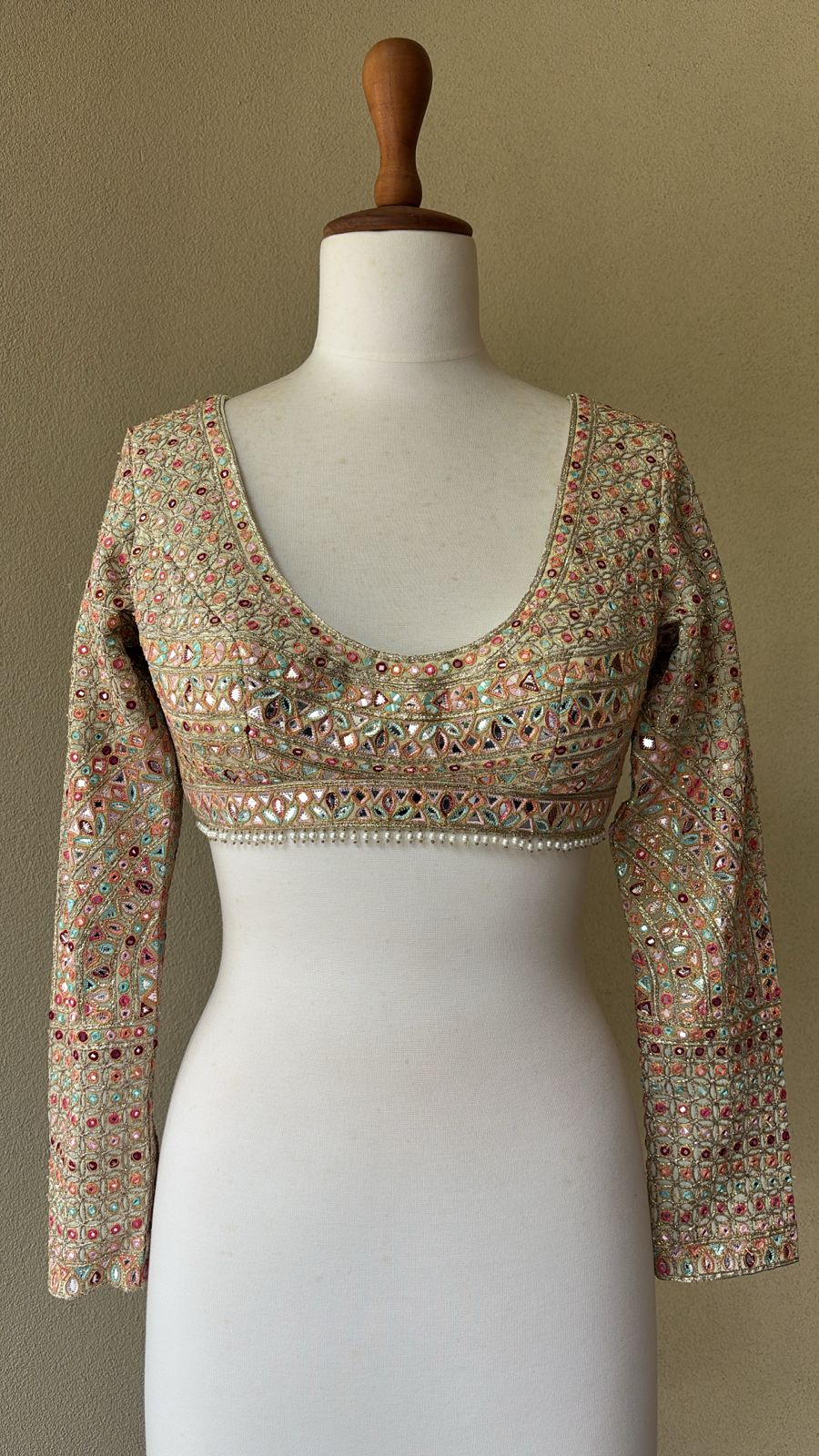 Green georgette blouse with multi colored foil embroidery