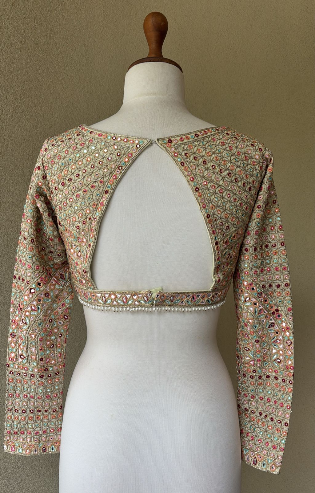 Green georgette blouse with multi colored foil embroidery