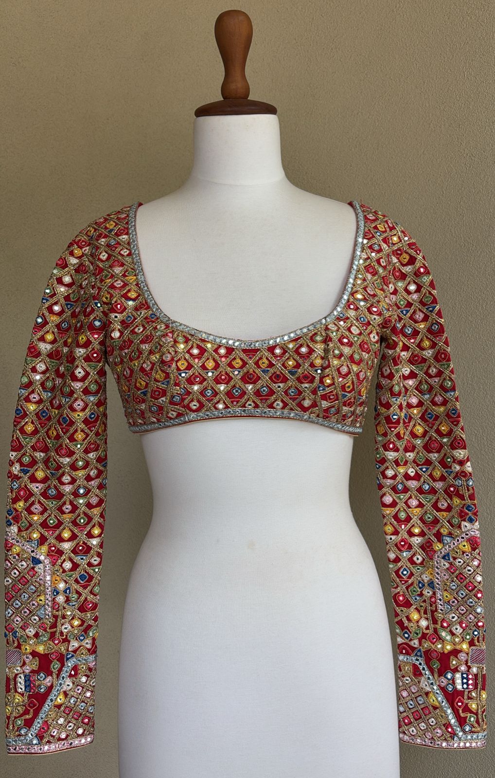 Red georgette blouse with multi colored, resham, gota, dori and mirror work