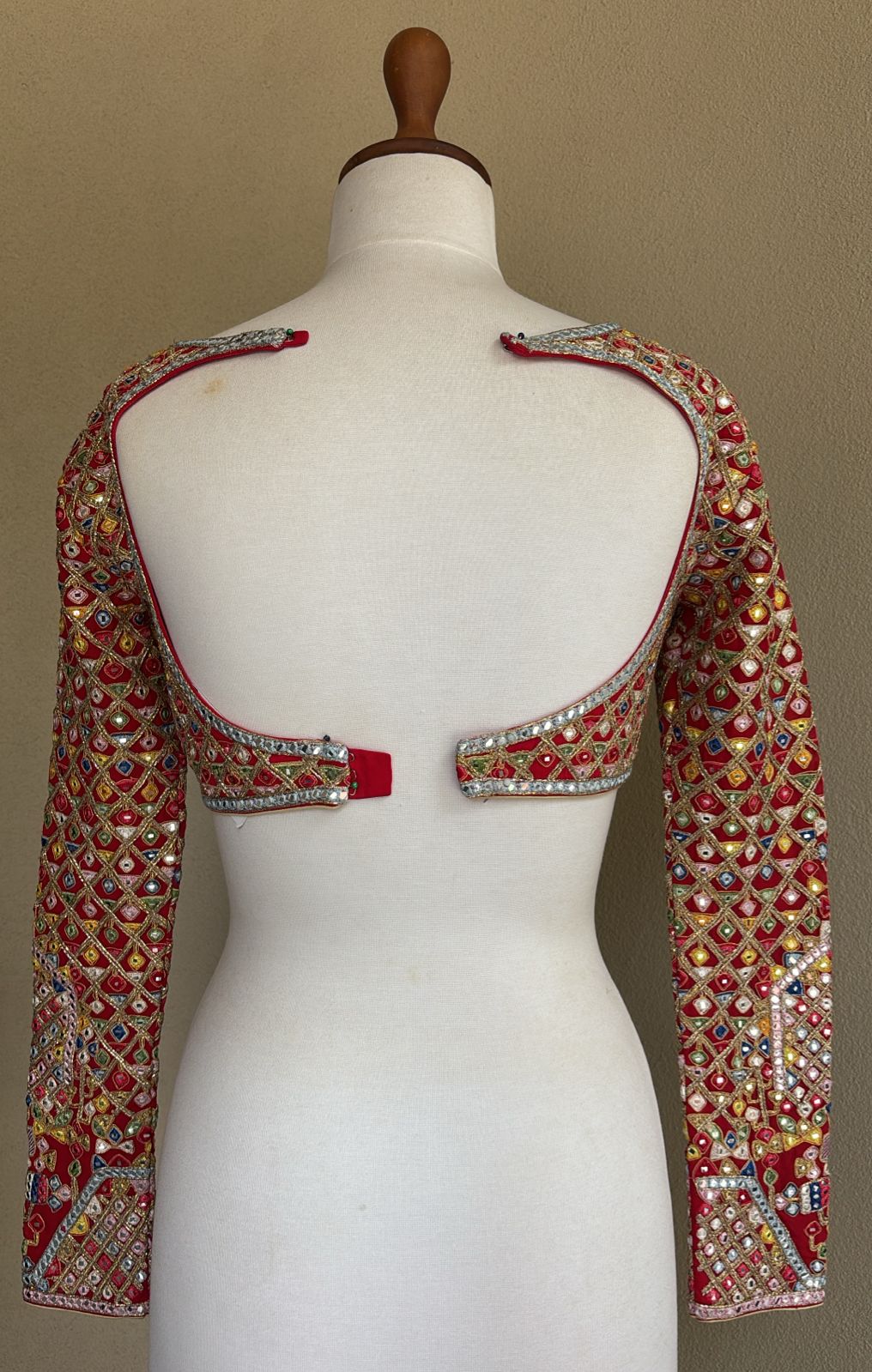 Red georgette blouse with multi colored, resham, gota, dori and mirror work