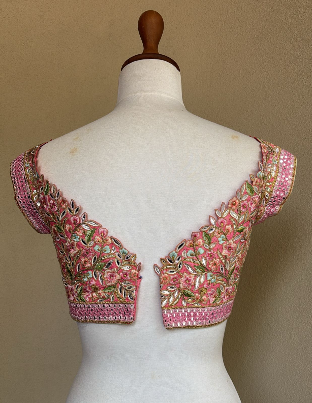 Pink off shoulder blouse with multi resham and foil work