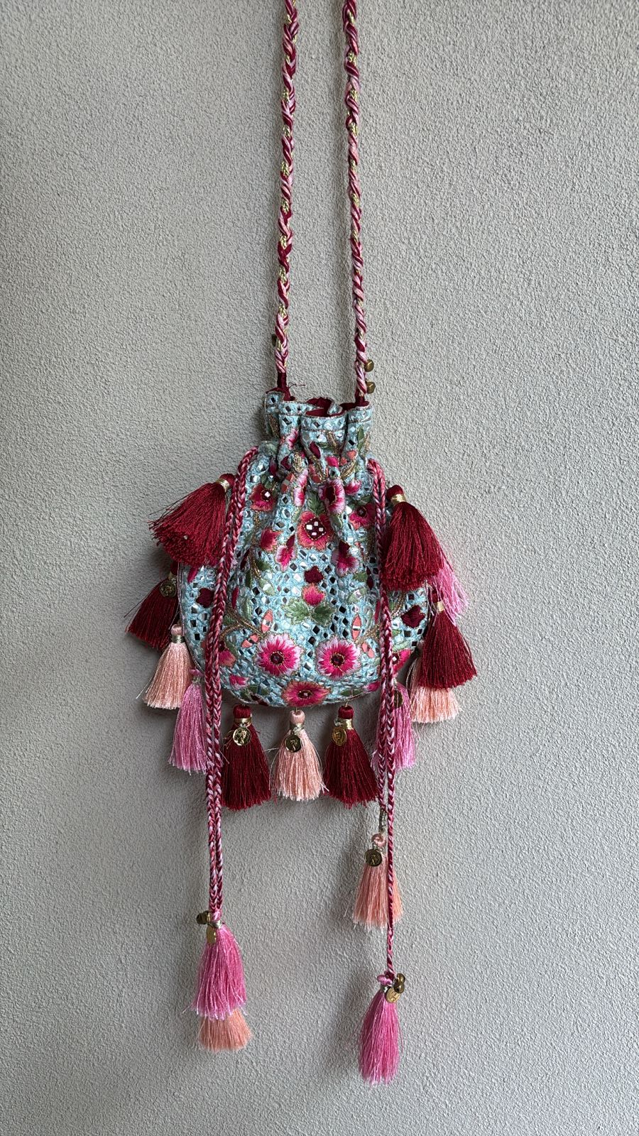 Blue mirror and resham work potli bag with tassels