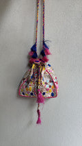 Ivory potli bag with resham, tassel and mirror detailing