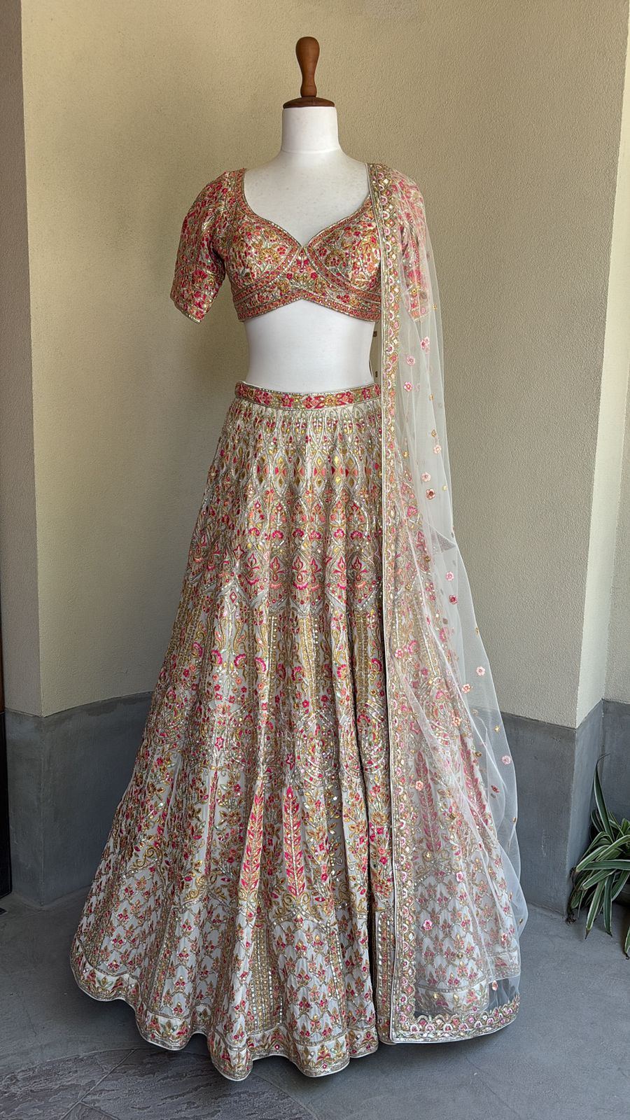 Ivory chanderi lehenga and blouse paired with a net dupatta