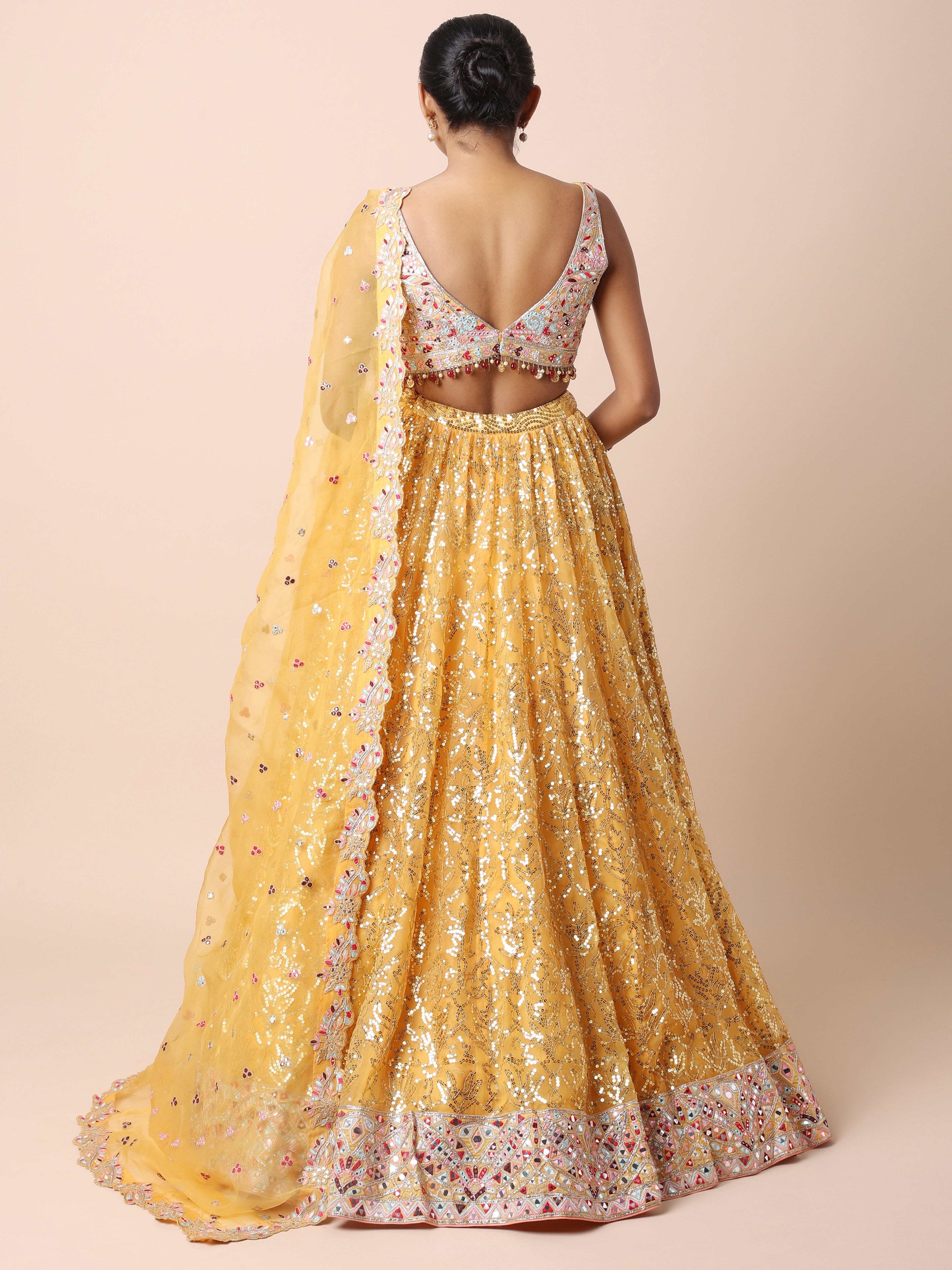 Orange Organza lehenga set with multi colored thread mirror and sequins