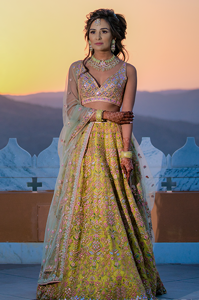 ANJ & PRI in a Green Net Lehenga with a Sage Green Dupatta