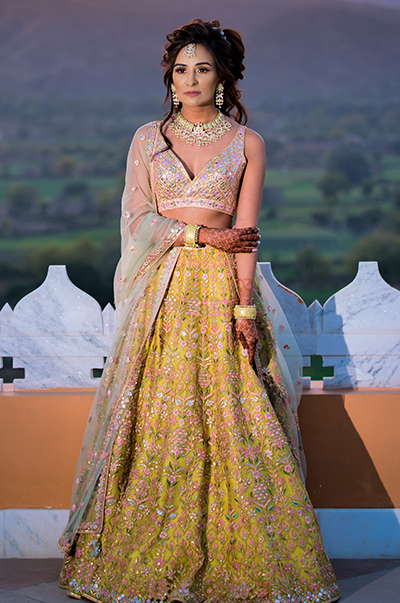 ANJ & PRI in a Green Net Lehenga with a Sage Green Dupatta