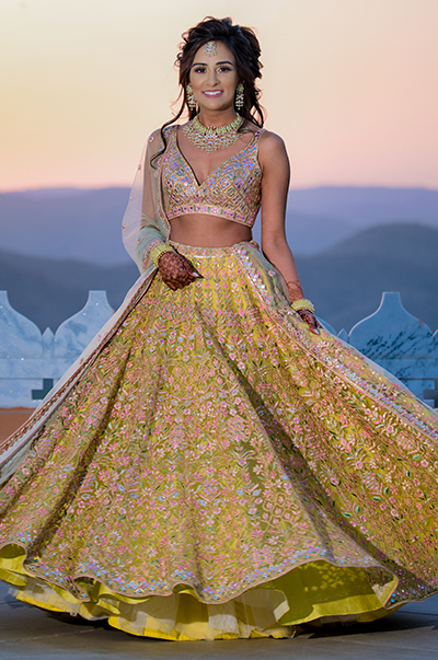 ANJ & PRI in a Green Net Lehenga with a Sage Green Dupatta