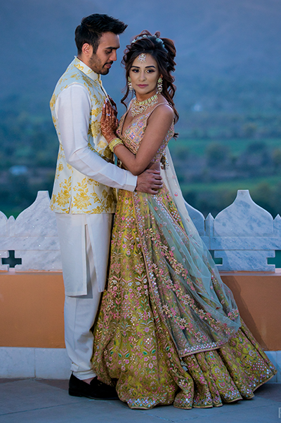 ANJ & PRI in a Green Net Lehenga with a Sage Green Dupatta