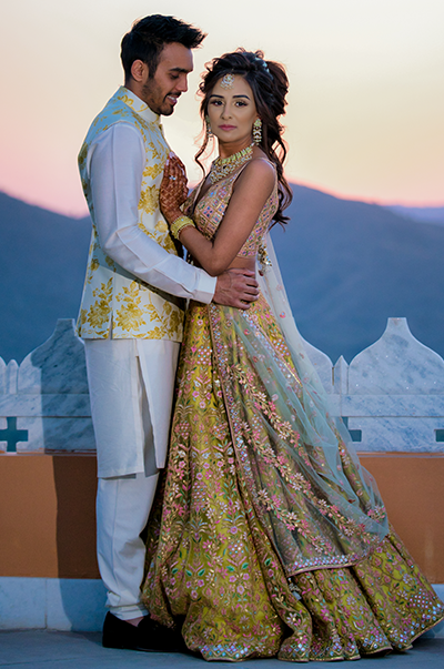ANJ & PRI in a Green Net Lehenga with a Sage Green Dupatta
