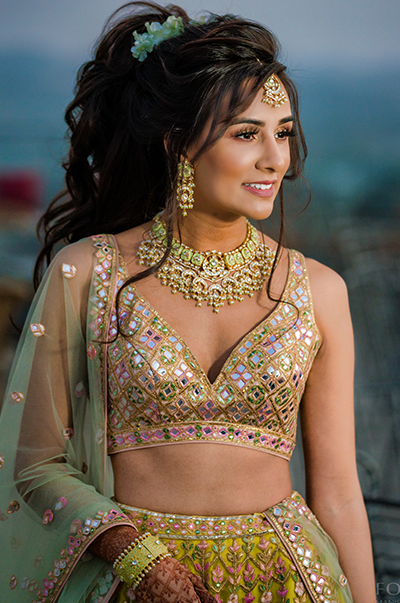 ANJ & PRI in a Green Net Lehenga with a Sage Green Dupatta