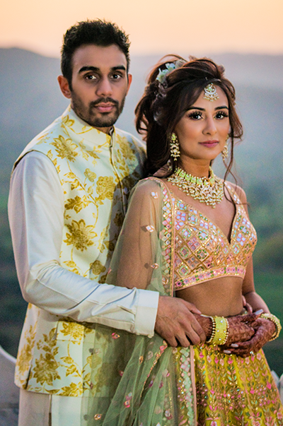 ANJ & PRI in a Green Net Lehenga with a Sage Green Dupatta
