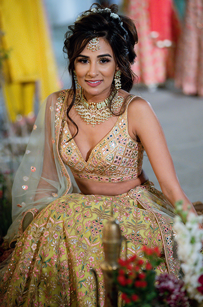ANJ & PRI in a Green Net Lehenga with a Sage Green Dupatta