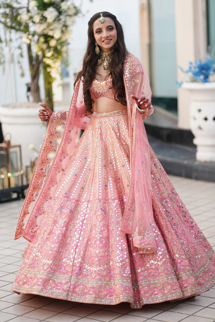 CHAHEL DHANDHANIA IN CORAL RAW SILK LEHENGA WITH FOIL, RESHAM