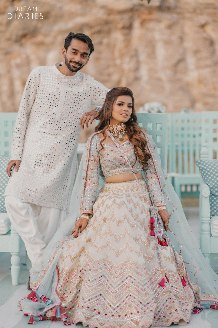 Jhanvi Kothari in Ivory Georgette Chevron Embroidered Lehenga Paired With A Blue Blouse And Organza Dupatta