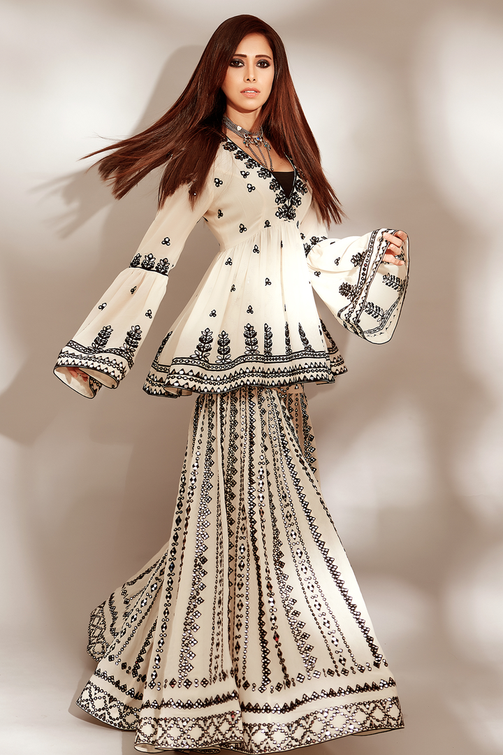 NUSHRAT BARUCHA IN BLACK AND WHITE PEPLUM GHARARA SET