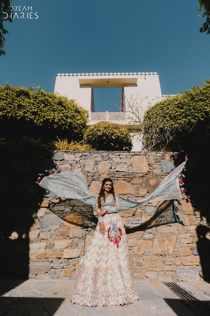 Jhanvi Kothari in Ivory Georgette Chevron Embroidered Lehenga Paired With A Blue Blouse And Organza Dupatta