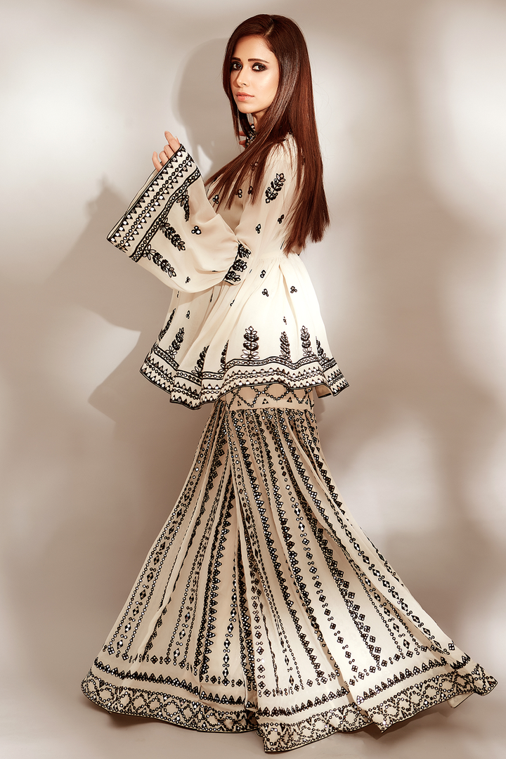 NUSHRAT BARUCHA IN BLACK AND WHITE PEPLUM GHARARA SET