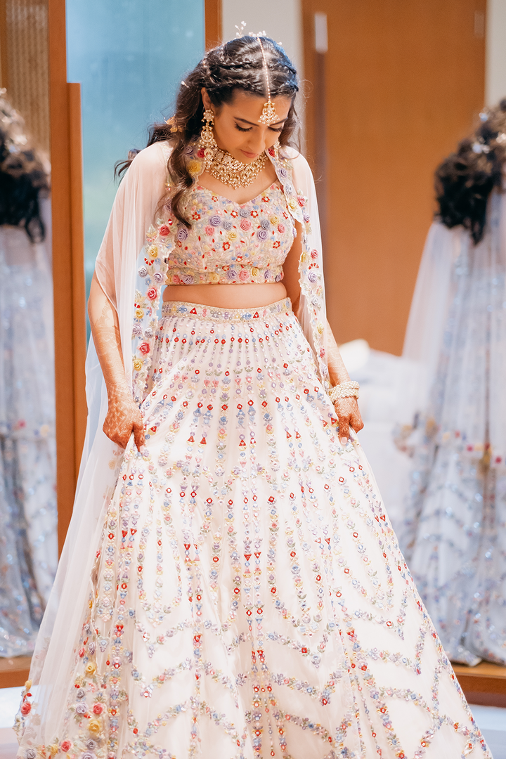 Roshni Lalmalani In Ivory Net Lehenga With 3D Flowers